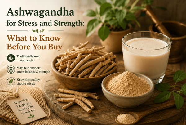Dried Ashwagandha roots, Ashwagandha powder, and a glass of warm milk arranged on a wooden surface, illustrating traditional Ayurvedic use for stress and strength.